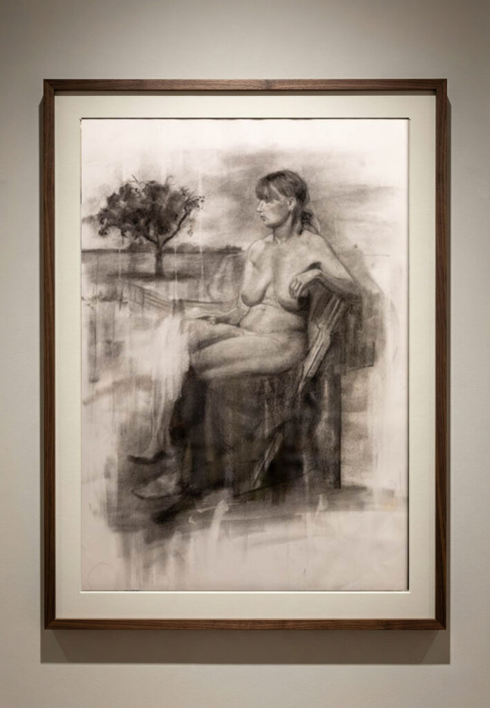 Framed charcoal drawing of a seated female figure beside a tree, by Csaba Tibor Palotas, tutor at Life Drawing MK in Milton Keynes